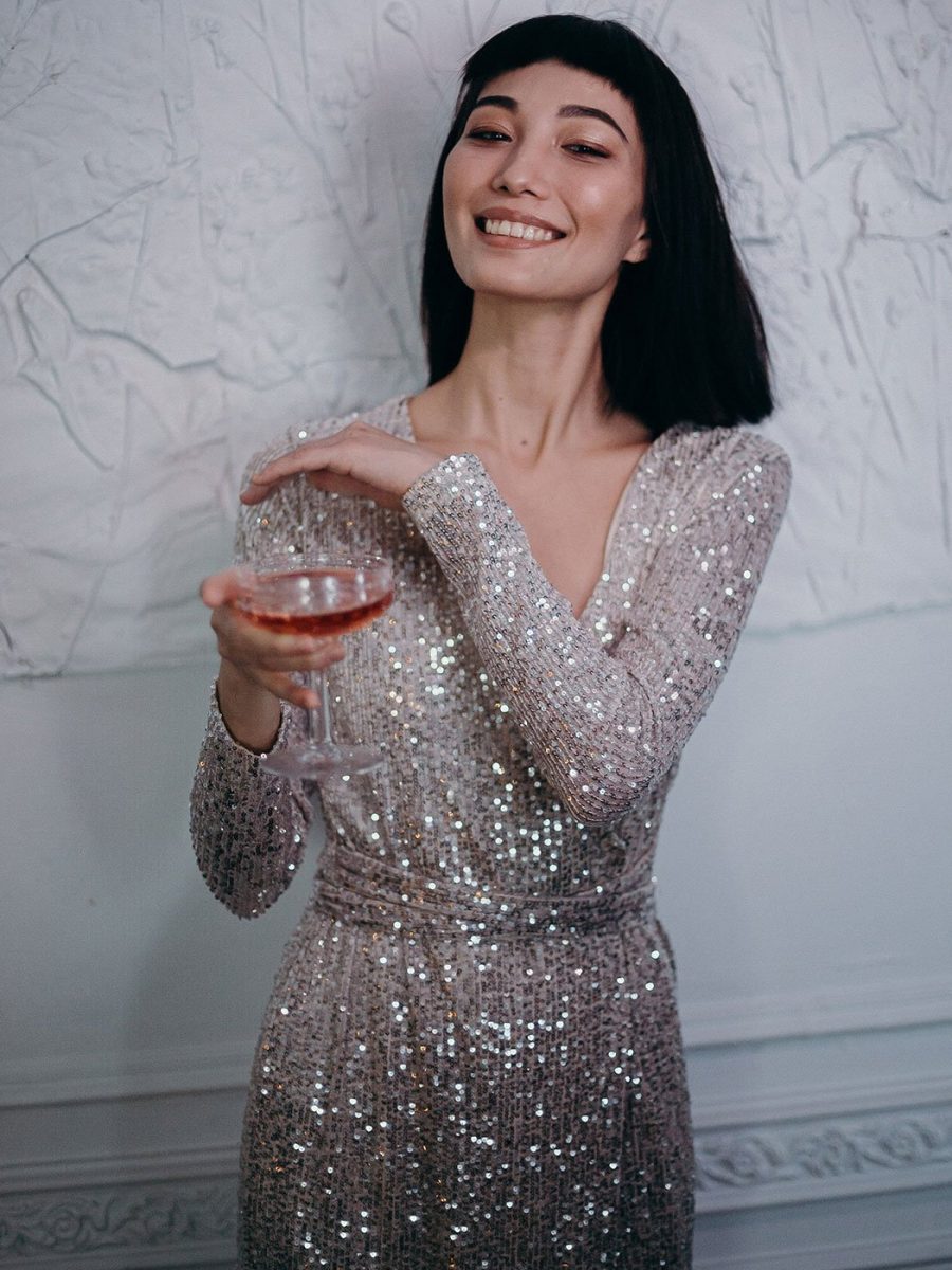 photo-of-woman-wearing-silver-dress-while-holding-cocktail-3402700